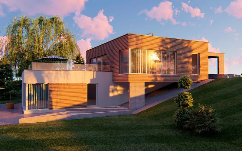 Flachdachhaus mit Holzfassade am Hang im Abendlicht